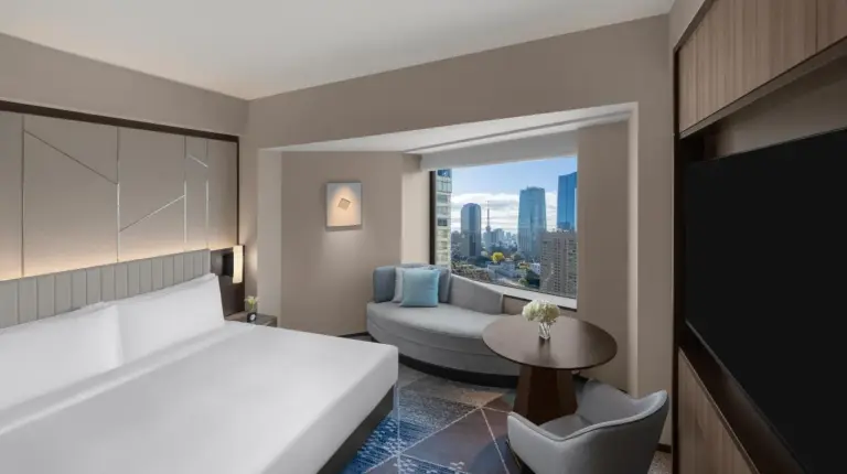 a hotel room with a bed and a couch at ANA InterContinental Tokyo by IHG in Tokyo