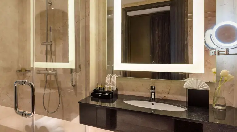 a bathroom with a sink and a shower at DoubleTree by Hilton Surabaya in Surabaya