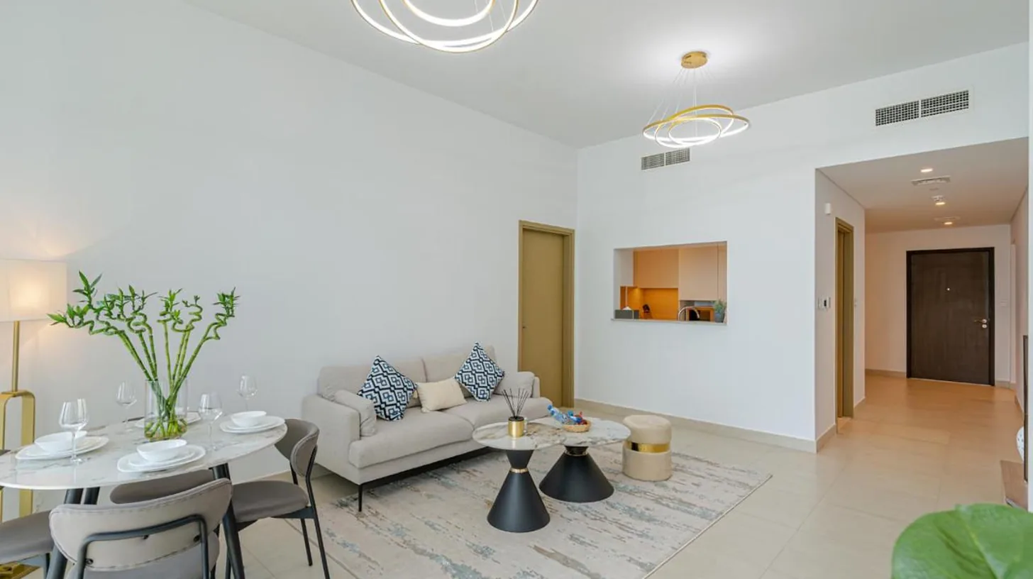 a living room with a couch and a table at Downtown Views 4702 in Dubai