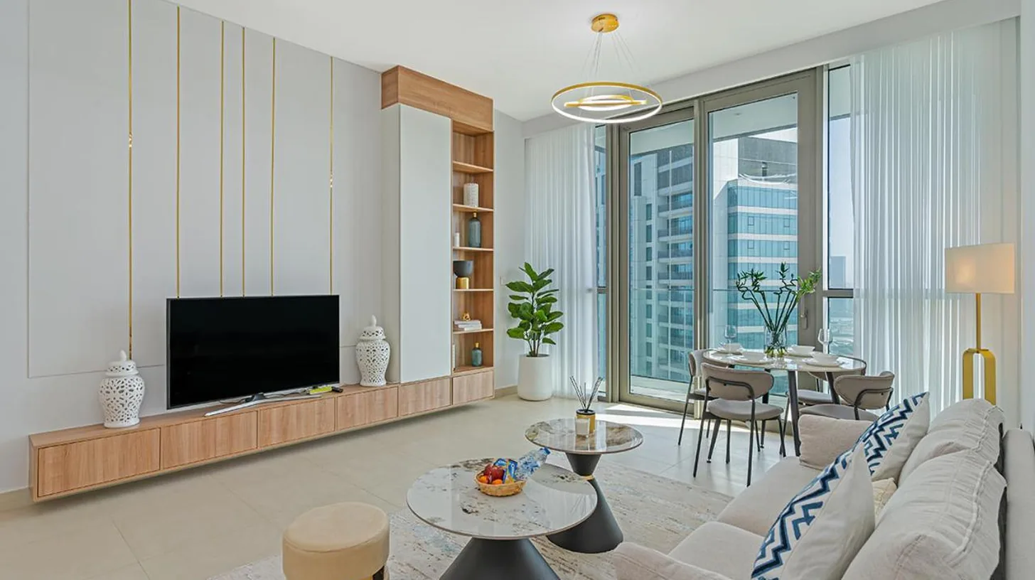 a bedroom with a large bed and a large window at Downtown Views 4702 in Dubai