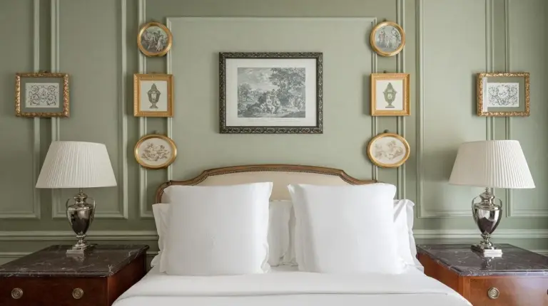 a bedroom with a bed and a table with a lamp at Four Seasons Hotel Firenze in Florence