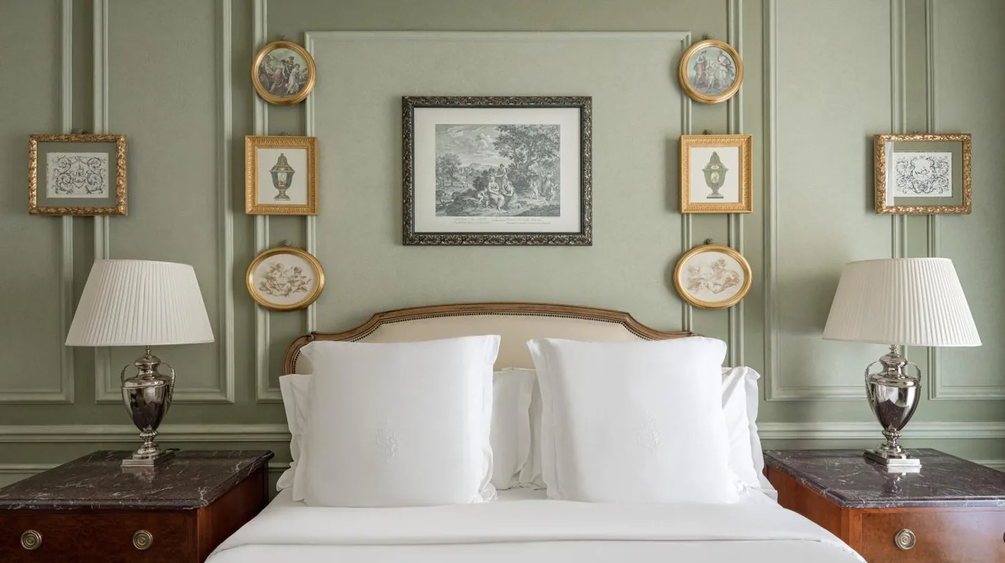 a bedroom with a bed and a table with a lamp at Four Seasons Hotel Firenze in Florence
