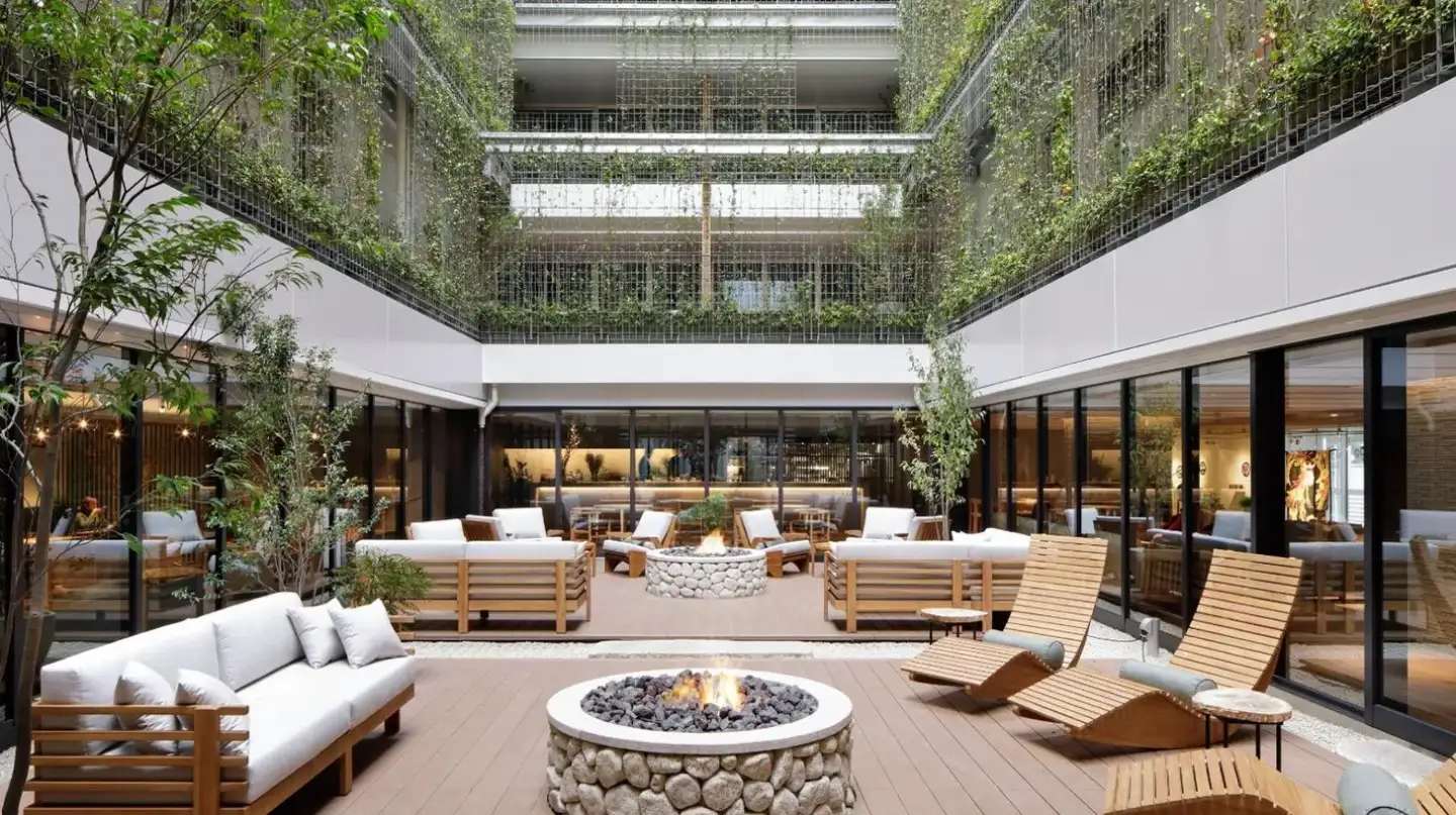 an outdoor patio with furniture and a fire pit at GOOD NATURE HOTEL KYOTO in Kyoto