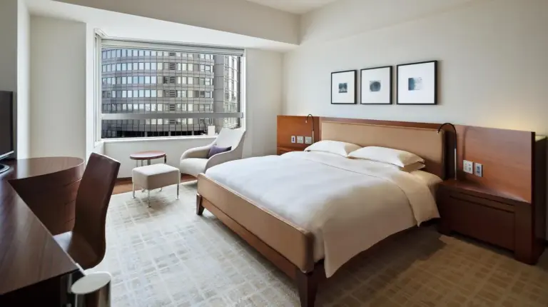 a bedroom with a large bed and a large window at Grand Hyatt Tokyo in Tokyo