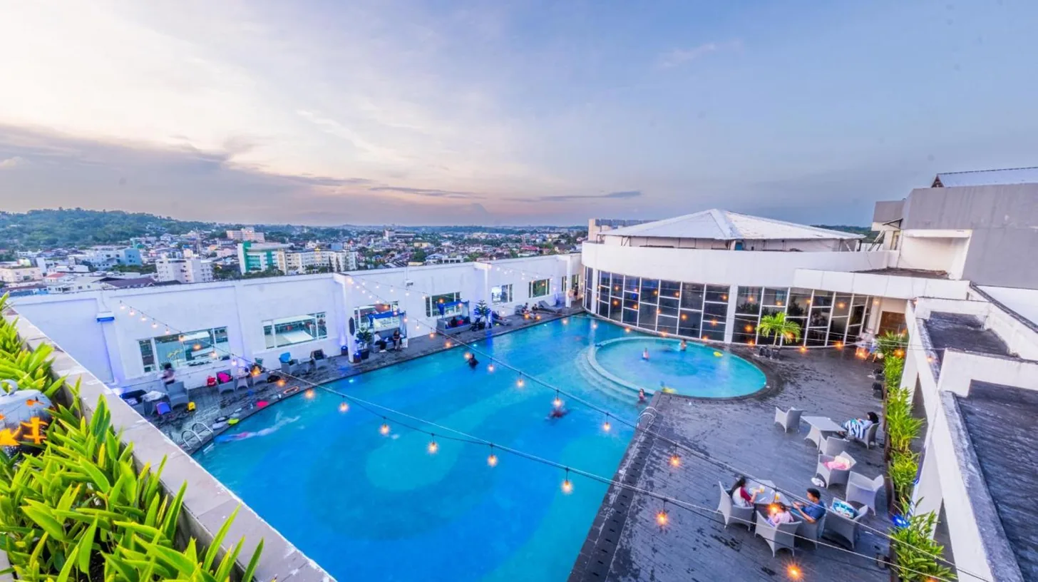 an overhead view of a pool on top of a building at Grand Jatra Hotel Balikpapan in Balikpapan
