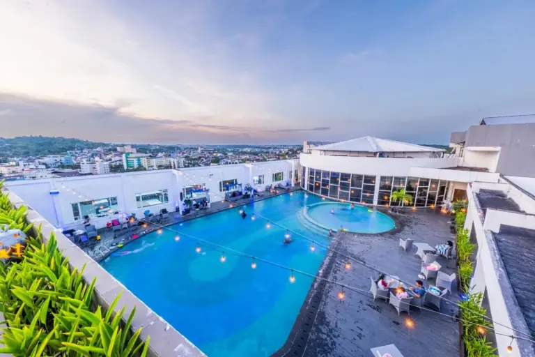 Beautiful rooftop pool at Grand Jatra Hotel Balikpapan with stunning sunset views