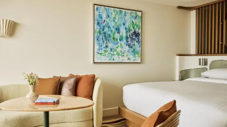 a hotel room with a bed and a window at Hotel Palais de la Mediterranee
