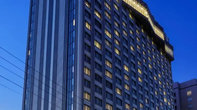 a tall building with lights on the side of it at Hyatt Regency Yokohama in Yokohama