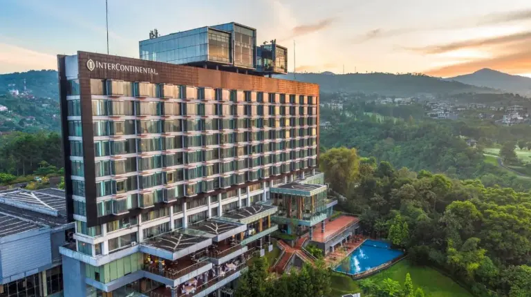an overhead view of a building with a pool at InterContinental Bandung Dago Pakar by IHG in Bandung