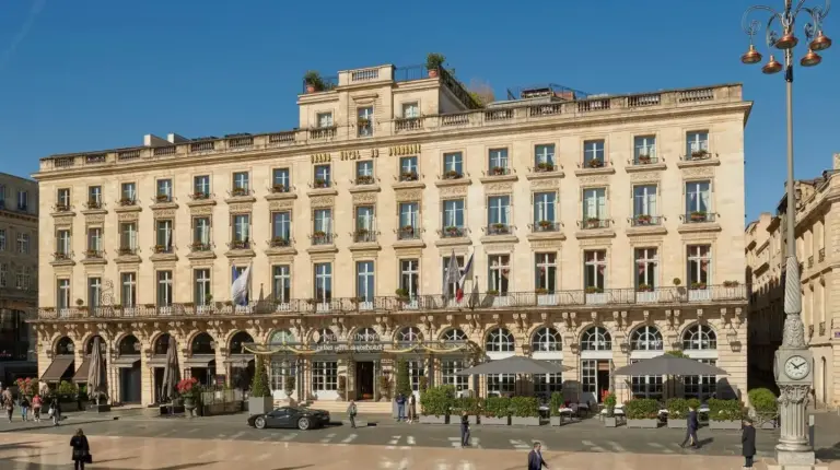 a large building with people walking in front of it at InterContinental Bordeaux Le Grand Hotel by IHG in Bordeaux