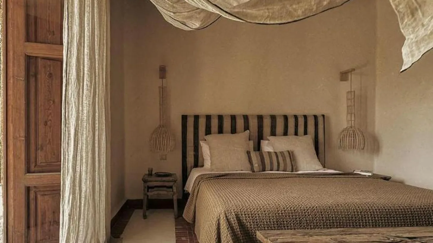 a bedroom with a large bed with a mosquito net at Kasbah d'if in Marrakech