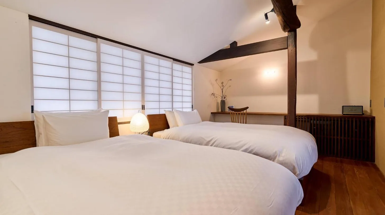 a black table with two towels on top of it at Kyoto Machiya Fukune in Kyoto