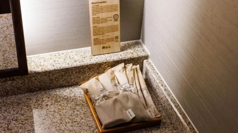 a suitcase sitting on the floor in a bathroom at Kyoto Ryokan SAKANOUE in Kyoto