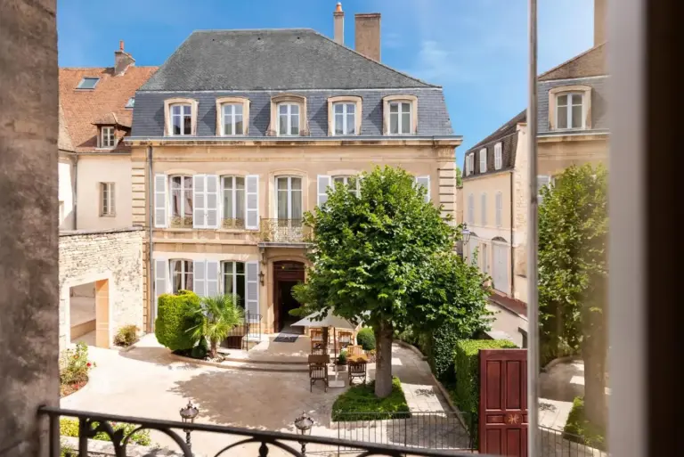 Exterior view of L'Hôtel in Beaune, showcasing the charming architecture and courtyard