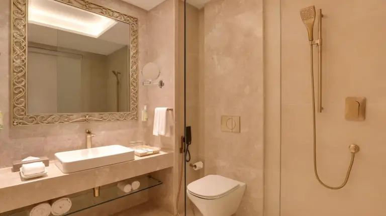 a hotel room with a bed and a large window at Lemon Tree Premier Budhanilkantha Kathmandu