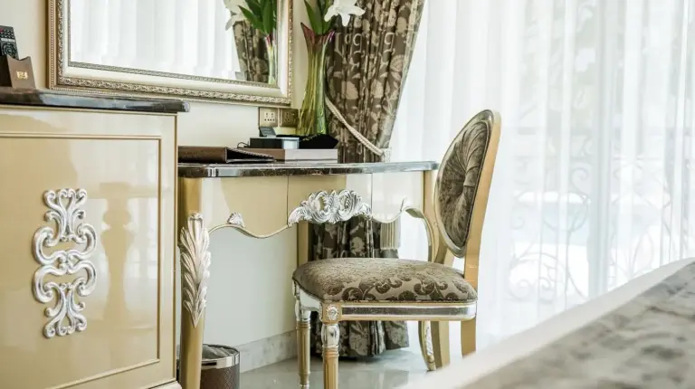 a chair in a room with a mirror at LK Emerald Beach - SHA Extra Plus in Pattaya North