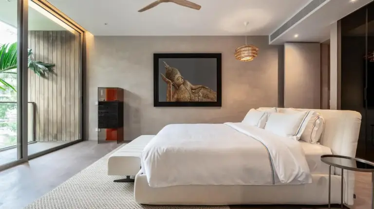 a bedroom with a large white bed and a ceiling at Luxury Penthouse 407sqm Beachfront and private pool in Phuket Town