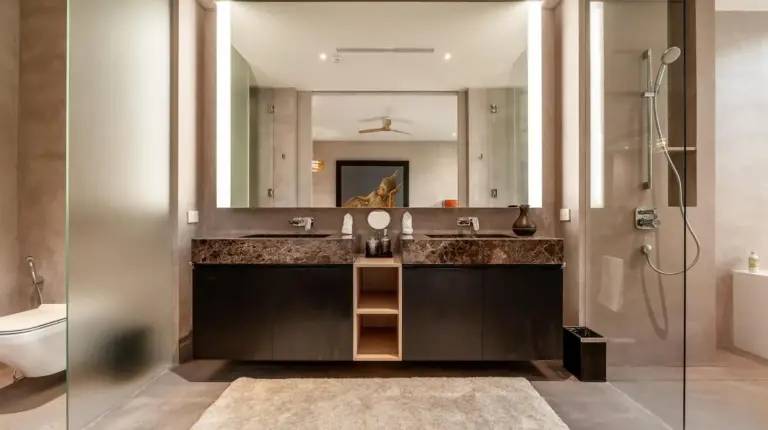 a bathroom with a sink and a mirror at Luxury Penthouse 407sqm Beachfront and private pool in Phuket Town