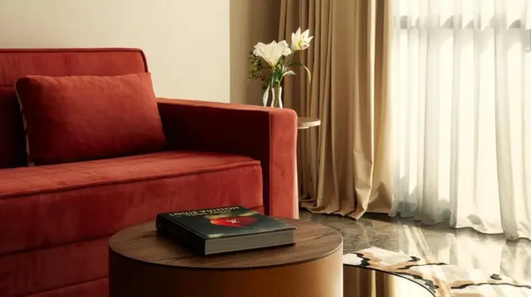a living room with a bed and a couch at Marly Boutique Hôtel in Casablanca