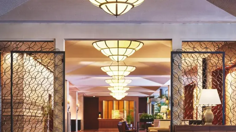 a lobby with large chandeliers hanging from the ceiling at Nagoya Kanko Hotel in Nagoya