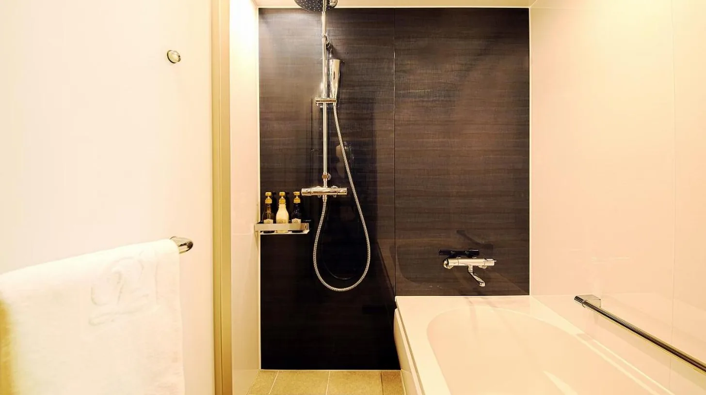 a bathroom with a shower and a bath tub at Nagoya Prince Hotel Sky Tower in Nagoya