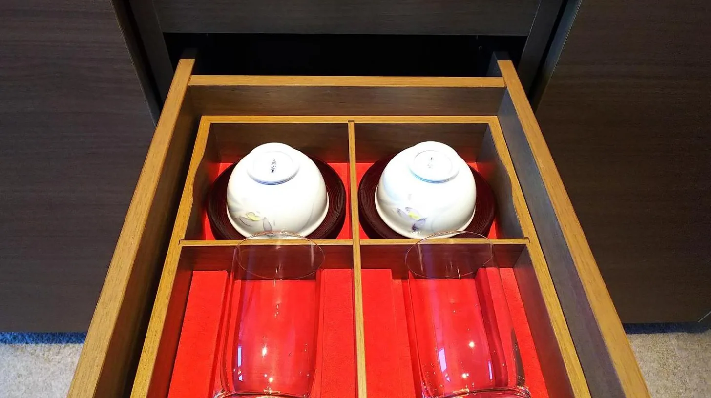 a wooden box with three red glasses in it at Nagoya Prince Hotel Sky Tower in Nagoya