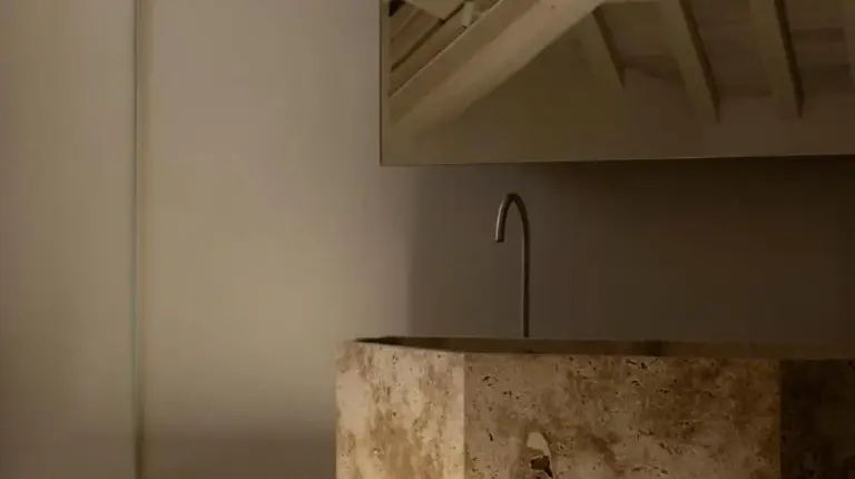 a concrete counter in a room with a ceiling at Nomos Hotel in Rome