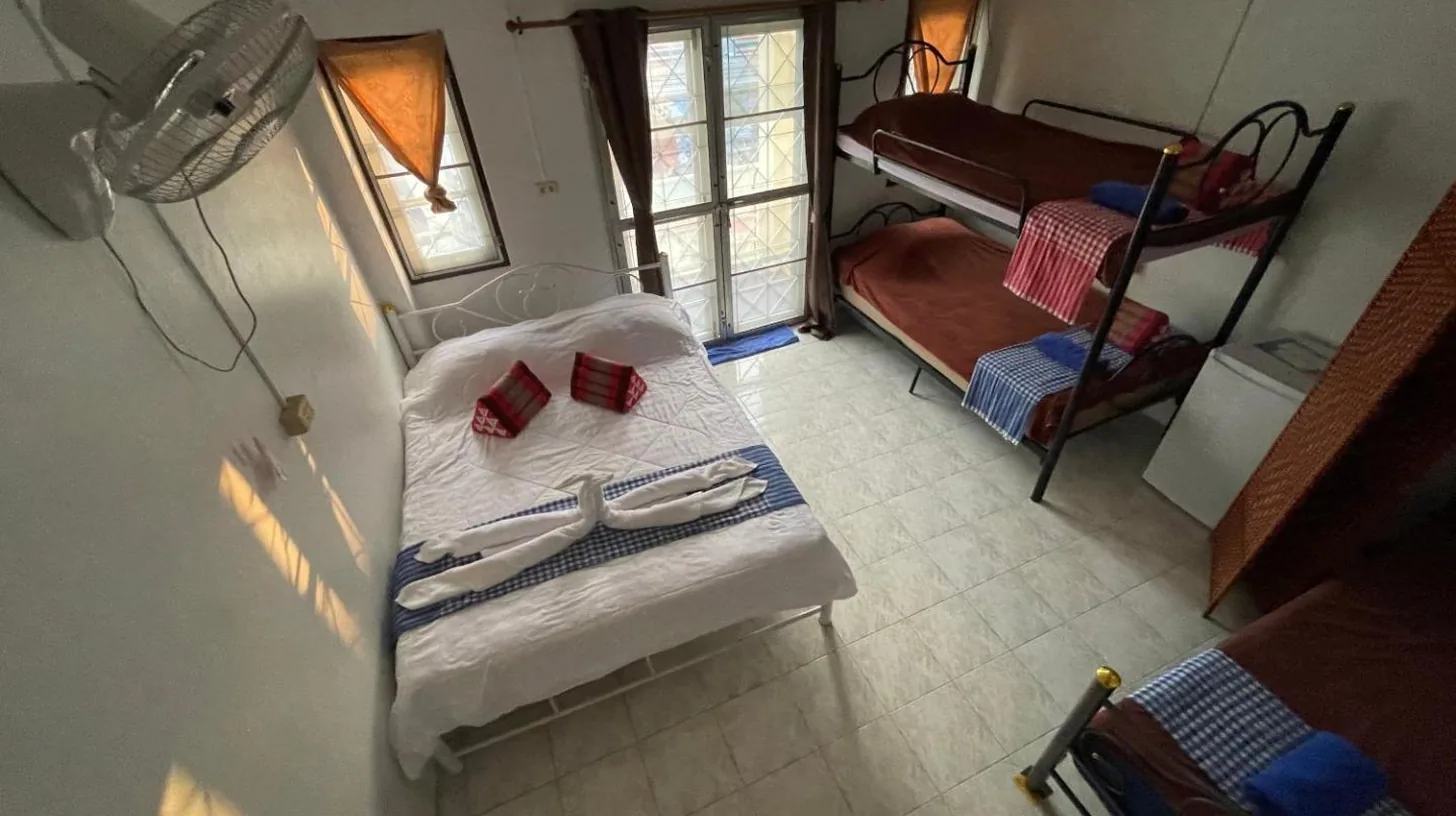 an overhead view of a bedroom with a bed and a bunk bed at Noot's Guesthouse in Kanchanaburi