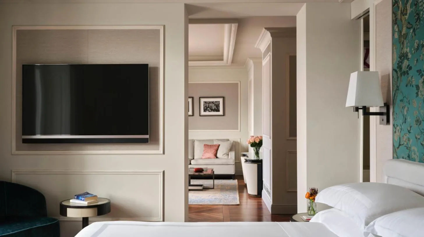 a bedroom with a bed and a flat screen tv at Palazzo Venezia in Como