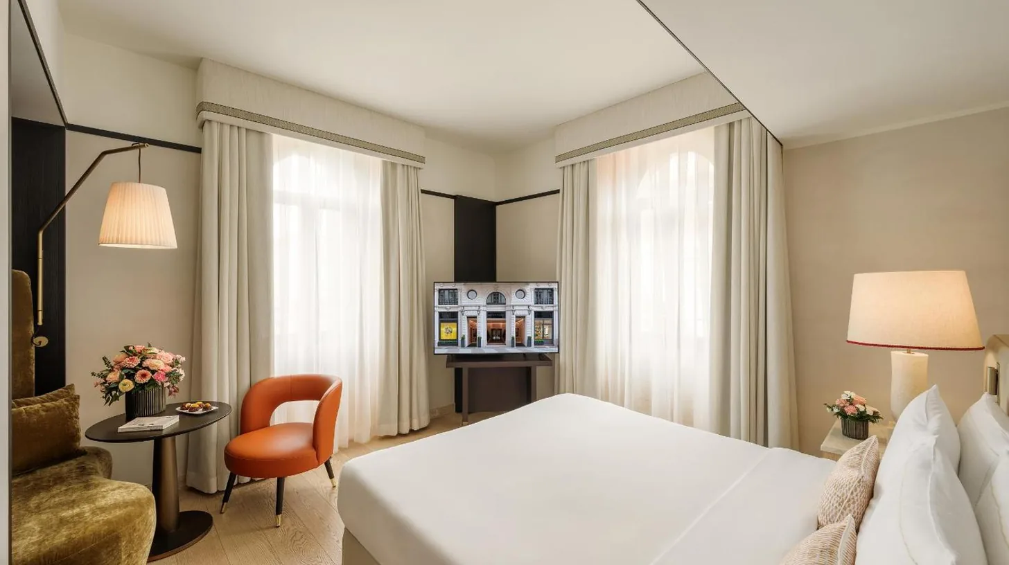 a hotel room with a bed and a chair at Park Hyatt Milano in Milan
