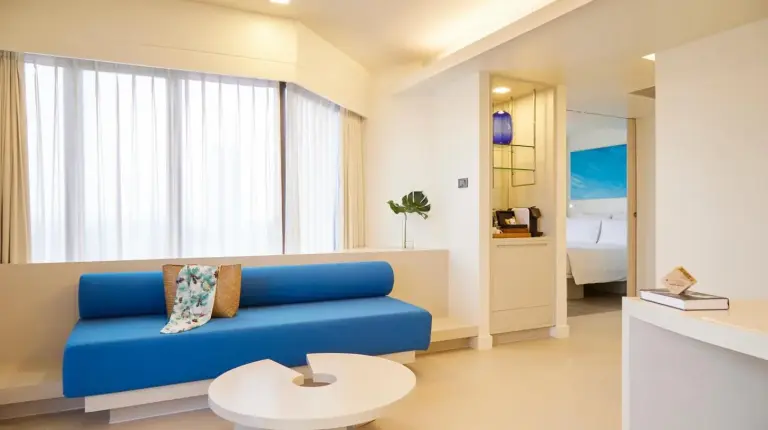 a hotel room with a bed and a desk at Pullman Pattaya Hotel G in Pattaya North