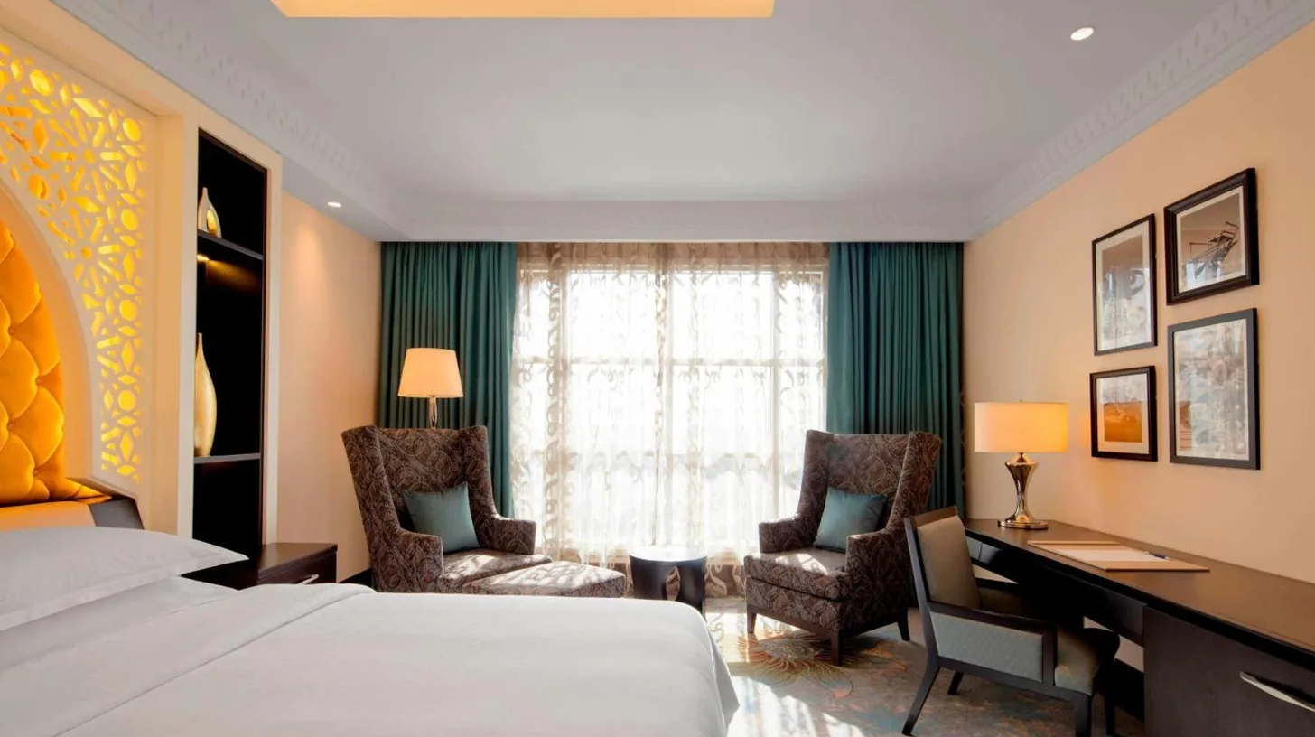 a bathroom with a sink and a mirror at Sheraton Sharjah Beach Resort and Spa in Sharjah