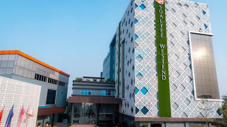 a building with a mosaic wall on the side of it at Soaltee Westend Itahari in Itahari