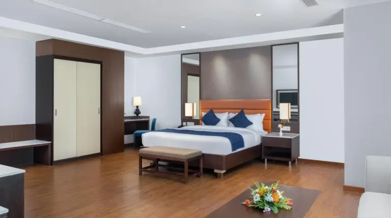 a hotel room with a bed and a table at Soaltee Westend Itahari in Itahari