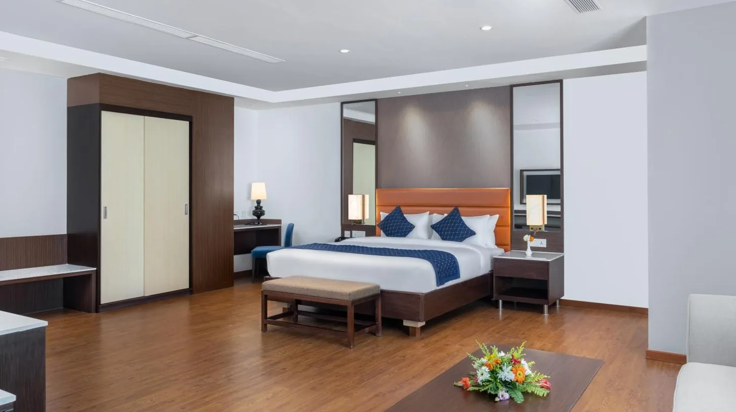 a hotel room with a bed and a table at Soaltee Westend Itahari in Itahari