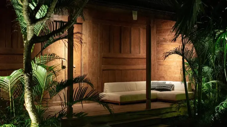 a living room with a couch in a room with plants at The Asa Maia - Bespoke Wellness Resort in Uluwatu