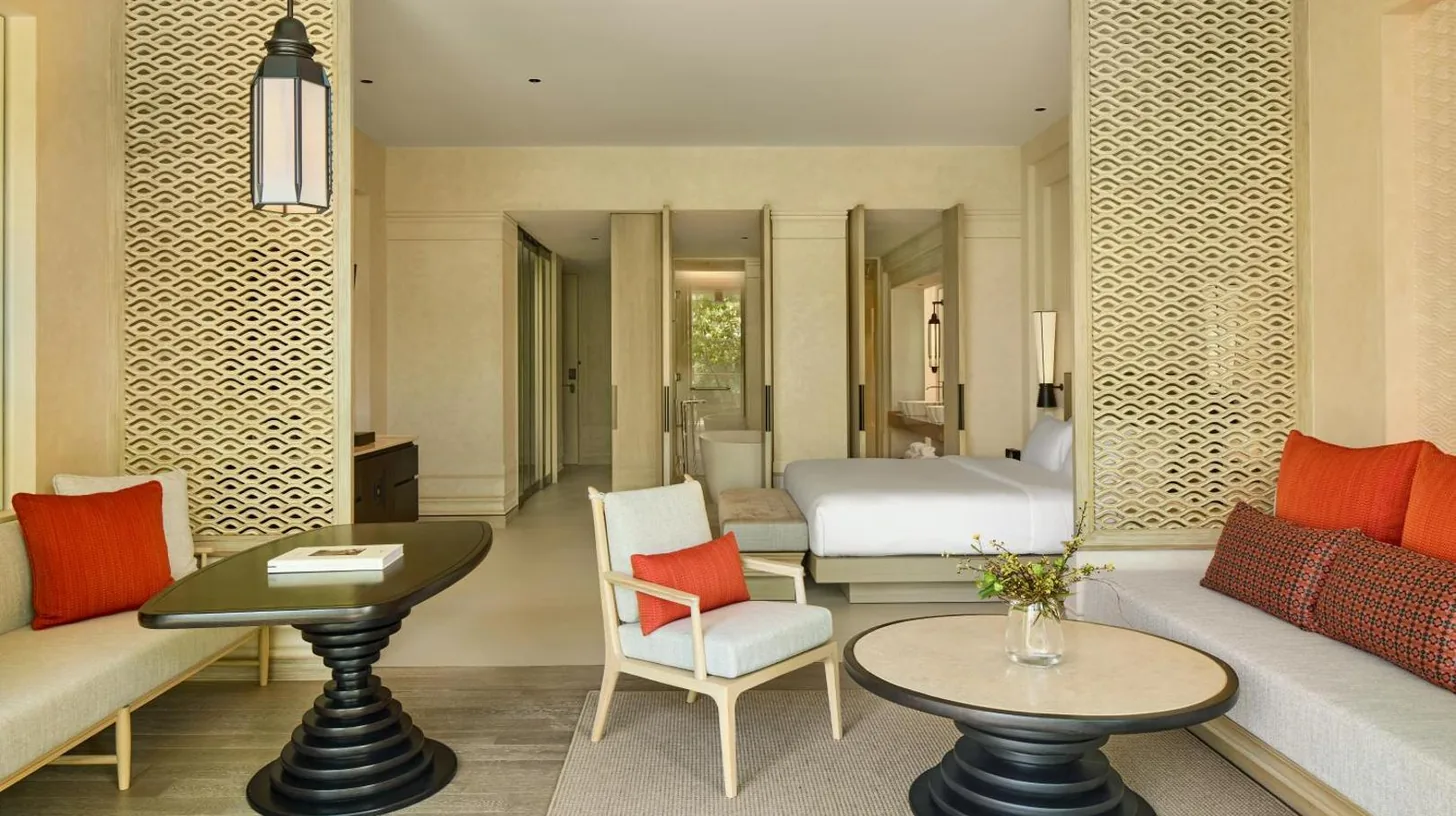 a living room with a couch and a bed at THE BARAI HUA HIN - The Unbound Collection by Hyatt in Hua Hin