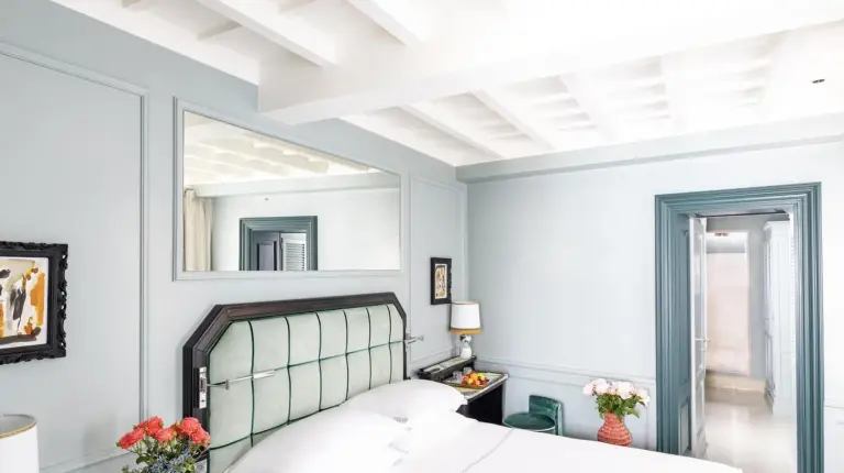 a bedroom with a bed and a mirror at The Place Firenze in Florence