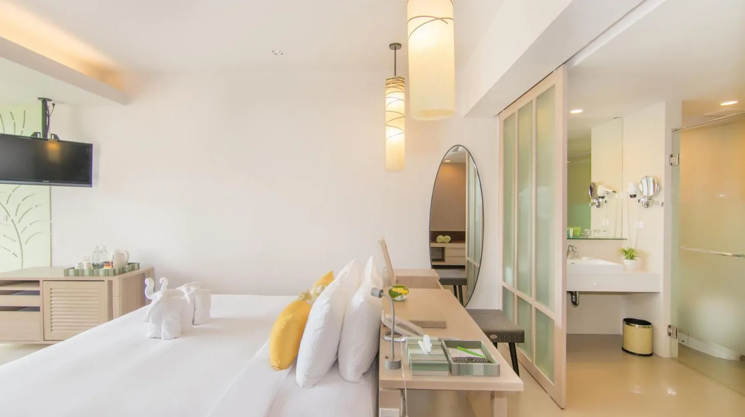 a white bedroom with a bed and a sink at The Sands Khao Lak by Katathani - SHA Extra Plus in Khao Lak