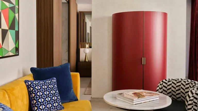 a hotel room with a bed and a table and chairs at W Florence in Florence